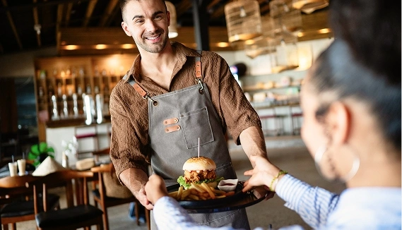 Man serving a customer food